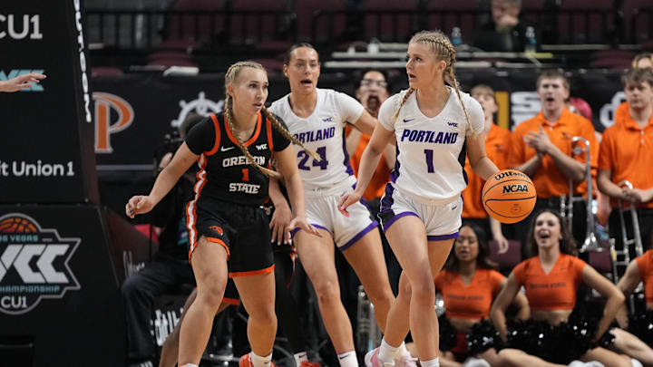 March 11, 2025; Las Vegas, NV, USA; Portland Pilots guard McKelle Meek (1) dribbles the basketball against Oregon State Beavers guard Kennedie Shuler (1) during the first half in the final of the West Coast Conference tournament at Orleans Arena. Mandatory Credit: Kyle Terada-Imagn Images