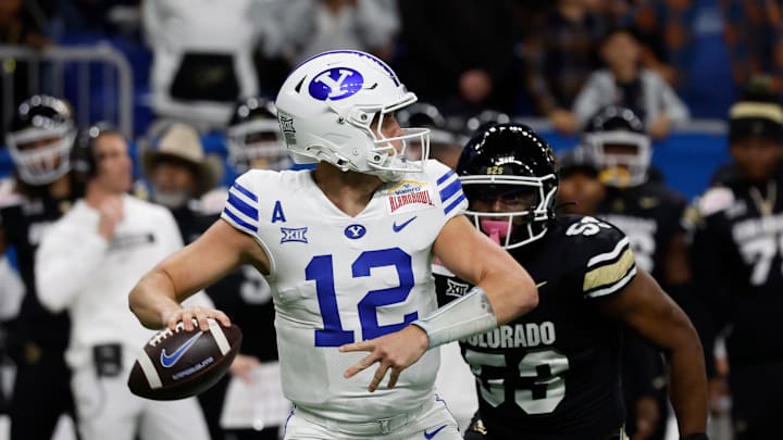 BYU' s Jake Retzlaff looks to pass vs Colorado in the 2024 Valero Alamo Bowl.