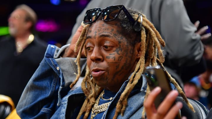 Oct 26, 2023; Los Angeles, California, USA; Recording artist Lil Wayne in attendance as the Los Angeles Lakers play against the Phoenix Suns during the first half at Crypto.com Arena. Oct 26, 2023; Los Angeles, California, USA; Recording artist Lil Wayne in attendance as the Los Angeles Lakers play against the Phoenix Suns during the first half at Crypto.com Arena.