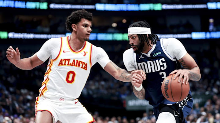 Apr 2, 2025; Dallas, Texas, USA;  Dallas Mavericks forward Anthony Davis (3) drives to the basket as Atlanta Hawks forward Dominick Barlow (0) defends during the first half at American Airlines Center. Mandatory Credit: Kevin Jairaj-Imagn Images