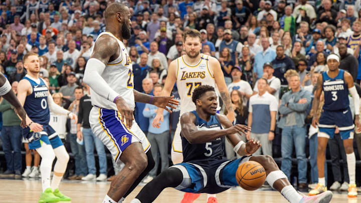 Apr 27, 2025; Minneapolis, Minnesota, USA; Minnesota Timberwolves guard Anthony Edwards (5) is fouled by Los Angeles Lakers forward LeBron James (23) in the fourth quarter during game four of first round for the 2025 NBA Playoffs at Target Center. Mandatory Credit: Matt Blewett-Imagn Images