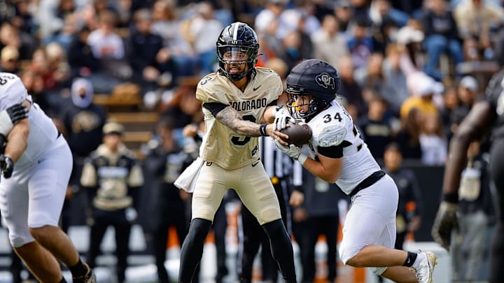 Apr 19, 2025; Boulder, CO, USA; Colorado Buffaloes quarterback Kaidon Salter (3) hands the ball off to running back Titus Bautista (34) during the spring game at Folsom Field. Mandatory Credit: Isaiah J. Downing-Imagn Images