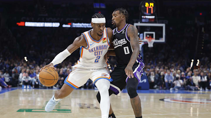Oct 28, 2025; Oklahoma City, Oklahoma, USA; Oklahoma City Thunder guard Shai Gilgeous-Alexander (2) drives past Sacramento Kings guard Malik Monk (0) during the second half at Paycom Center. Mandatory Credit: Alonzo Adams-Imagn Images Oct 28, 2025; Oklahoma City, Oklahoma, USA; Oklahoma City Thunder guard Shai Gilgeous-Alexander (2) drives past Sacramento Kings guard Malik Monk (0) during the second half at Paycom Center. Mandatory Credit: Alonzo Adams-Imagn Images
