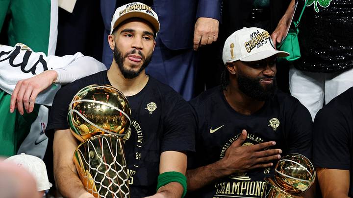 Jun 17, 2024; Boston, Massachusetts, USA; Boston Celtics forward Jayson Tatum (0) and guard Jaylen Brown (7) celebrates with the Larry O’Brian Trophy after beating the Dallas Mavericks in game five of the 2024 NBA Finals to win the NBA Championship at TD Garden. Mandatory Credit: Peter Casey-USA TODAY Sports Jun 17, 2024; Boston, Massachusetts, USA; Boston Celtics forward Jayson Tatum (0) and guard Jaylen Brown (7) celebrates with the Larry O’Brian Trophy after beating the Dallas Mavericks in game five of the 2024 NBA Finals to win the NBA Championship at TD Garden. Mandatory Credit: Peter Casey-USA TODAY Sports