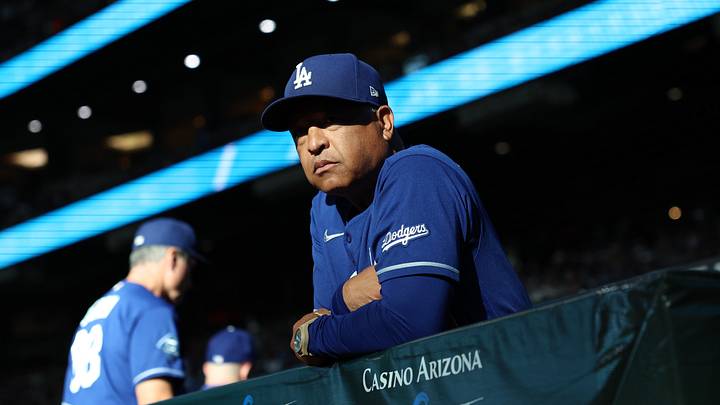 Aug 8, 2026; Phoenix, Arizona, USA;  Los Angeles Dodgers manager Dave Roberts (4) looks out to the field before the game against the Arizona Diamondbacks at Chase Field. Mandatory Credit: Anna Carrington-Imagn Images
