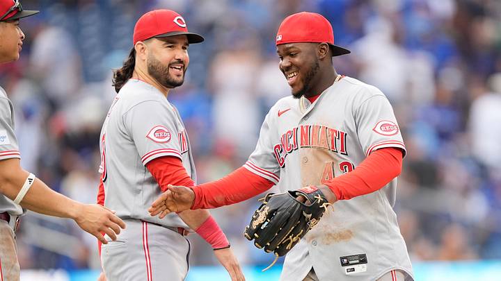 Sep 26, 2026; Toronto, Ontario, CAN; Cincinnati Reds designated hitter Eugenio Suarez (28) and right fielder Hector Rodriguez (43) celebrate after a win over the Toronto Blue Jays at Rogers Centre. Mandatory Credit: John E. Sokolowski-Imagn Images Sep 26, 2026; Toronto, Ontario, CAN; Cincinnati Reds designated hitter Eugenio Suarez (28) and right fielder Hector Rodriguez (43) celebrate after a win over the Toronto Blue Jays at Rogers Centre. Mandatory Credit: John E. Sokolowski-Imagn Images