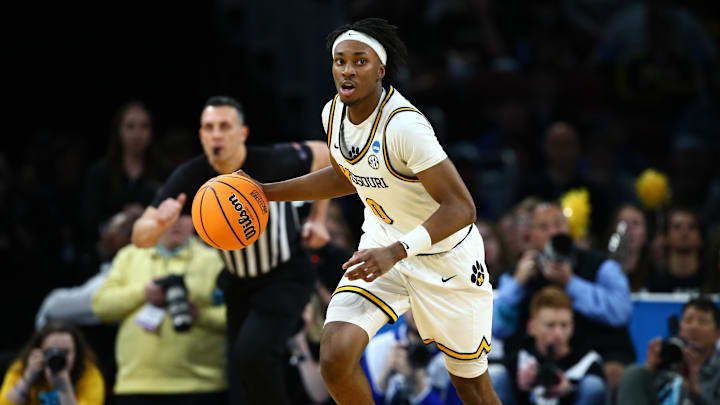 Mar 20, 2025; Wichita, KS, USA; Missouri Tigers guard Anthony Robinson II (0) dribbles in the first half of a first round men’s NCAA Tournament game against the Drake Bulldogs at Intrust Bank Arena. Mandatory Credit: Nick Tre. Smith-Imagn Images Mar 20, 2025; Wichita, KS, USA; Missouri Tigers guard Anthony Robinson II (0) dribbles in the first half of a first round men’s NCAA Tournament game against the Drake Bulldogs at Intrust Bank Arena. Mandatory Credit: Nick Tre. Smith-Imagn Images