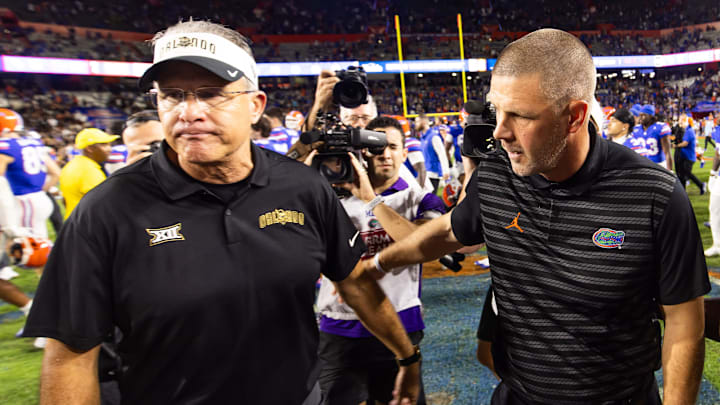 UCF Knights head coach Gus Malzahn, left, walks away with a frown after meeting Florida Gators head coach Billy Napier at mid-field after the Gators defeated the Knights at Ben Hill Griffin Stadium in Gainesville, FL on Saturday, October 5, 2024. The Gators defeated the Knights 24-13. [Doug Engle/Gainesville Sun]