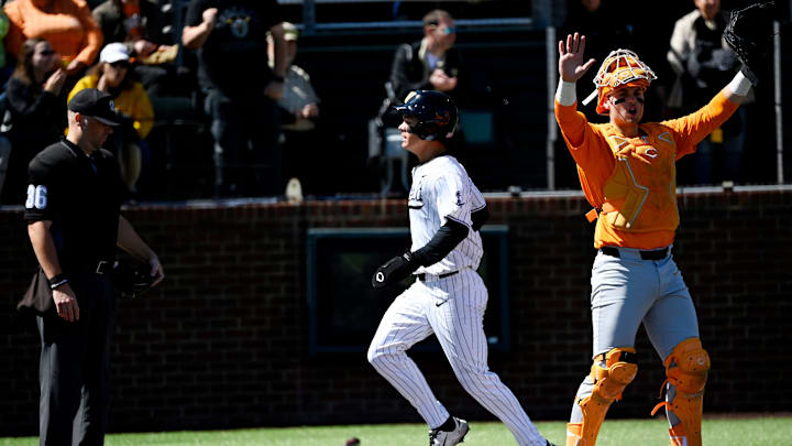 Vanderbilt's Rustan Rigdon (19) scores after a double hit by Chris Maldonado (8) off Tennessee pitcher Landon Mack (18) during the fourth inning of a NCAA baseball game at Hawkins Field on Saturday, March 28, 2026, in Nashville, Tenn. Vanderbilt's Rustan Rigdon (19) scores after a double hit by Chris Maldonado (8) off Tennessee pitcher Landon Mack (18) during the fourth inning of a NCAA baseball game at Hawkins Field on Saturday, March 28, 2026, in Nashville, Tenn.