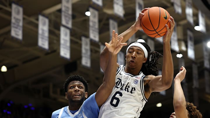 North Carolina v Duke; Duke basketball center Maliq Brown grabs a rebound in a game against North Carolina