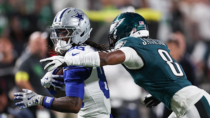 Sep 4, 2025; Philadelphia, Pennsylvania, USA; Philadelphia Eagles cornerback Adoree' Jackson (8) tackles Dallas Cowboys wide receiver CeeDee Lamb (88) during the first quarter of the game at Lincoln Financial Field. Mandatory Credit: Bill Streicher-Imagn Images