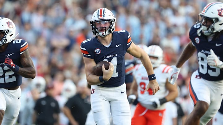 Nov 22, 2025; Auburn, Alabama, USA;  Auburn Tigers quarterback Jackson Arnold (11) runs for a touchdown in the fourth quarter against the Mercer Bears at Jordan-Hare Stadium. Mandatory Credit: John Reed-Imagn Images