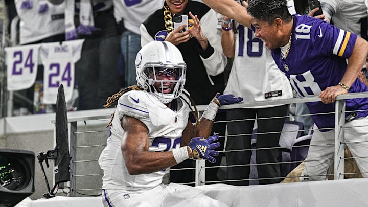 Dec 16, 2024; Minneapolis, Minnesota, USA; Minnesota Vikings running back Aaron Jones (33) reacts after a touchdown run during the third quarter against the Chicago Bears at U.S. Bank Stadium. Mandatory Credit: Jeffrey Becker-Imagn Images