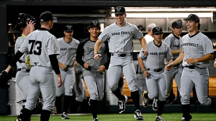 Vanderbilt’s J.D. Thompson jumps as he celebrates with his teammates after defeating Tennessee Tech in a NCAA college baseball game at Hawkins Field Tuesday, Feb. 25, 2025, in Nashville, Tenn. Vanderbilt won 16-3 in seven innings.