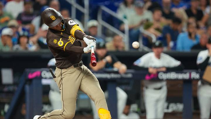Jul 25, 2026; Miami, Florida, USA; San Diego Padres right fielder Jase Bowen (4) hits a two-run single against the Miami Marlins during the eighth inning at loanDepot Park. Mandatory Credit: Sam Navarro-Imagn Images