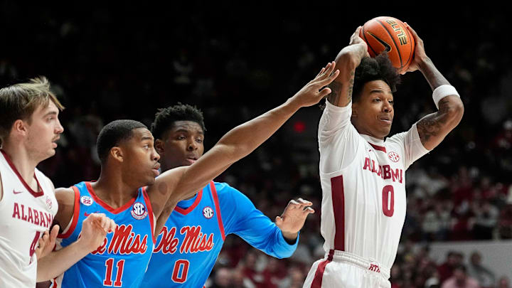 Jan 14, 2025; Tuscaloosa, AL, USA; Alabama guard Labaron Philon (0) makes a pass as he is defended by Ole Miss guard Matthew Murrell (11) and Ole Miss forward Malik Dia (0) at Coleman Coliseum. Mandatory Credit: Gary Cosby Jr.-Tuscaloosa News Jan 14, 2025; Tuscaloosa, AL, USA; Alabama guard Labaron Philon (0) makes a pass as he is defended by Ole Miss guard Matthew Murrell (11) and Ole Miss forward Malik Dia (0) at Coleman Coliseum. Mandatory Credit: Gary Cosby Jr.-Tuscaloosa News