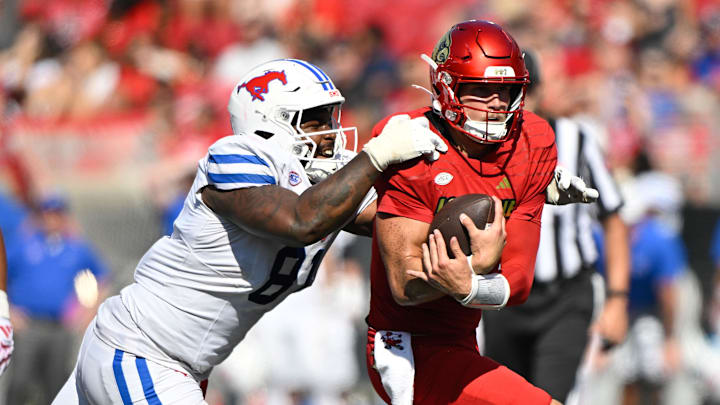 Jared Harrison-Hunte sacks Louisville quarterback Tyler Shough. Jared Harrison-Hunte sacks Louisville quarterback Tyler Shough.