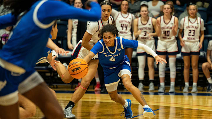 Buffalo's Noelani Cornfield (4) reaches for the ball as the University of Southern Indiana Screaming Eagles play the University of Buffalo Bulls during the WNIT Super 16 at Liberty Arena in Evansville, Ind., Thursday, March 27, 2025.