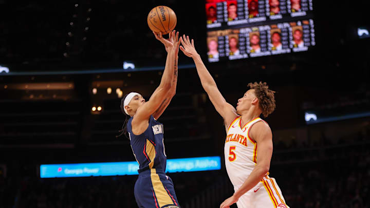 Dec 2, 2024; Atlanta, Georgia, USA; New Orleans Pelicans guard Brandon Boston Jr. (11) shoots over Atlanta Hawks guard Dyson Daniels (5) in the third quarter at State Farm Arena. Mandatory Credit: Brett Davis-Imagn Images