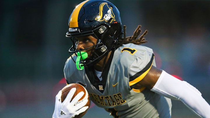 Former American Heritage Patriots receiver Malachi Toney (1) runs the ball during the first quarter of a game against the Naples Golden Eagles at Staver Field in Naples on Friday, Sept. 13, 2024.