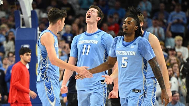 Dec 31, 2024; Omaha, Nebraska, USA;  Creighton Bluejays center Ryan Kalkbrenner (11) celebrates with guard Jamiya Neal (5) and forward Mason Miller (13) after a basket against the St. John's Red Storm during the second half at CHI Health Center Omaha. Mandatory Credit: Steven Branscombe-Imagn Images