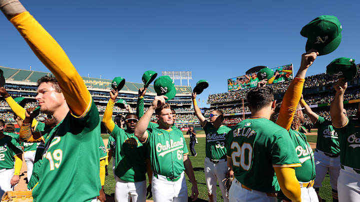 Athletics players celebrating fans after playing their last game in Oakland
