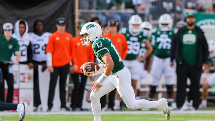 Sep 6, 2025; Athens, Ohio, USA; Ohio Bobcats quarterback Parker Navarro (13) runs the ball during the third quarter against the West Virginia Mountaineers at Peden Stadium. Mandatory Credit: Ben Queen-Imagn Images