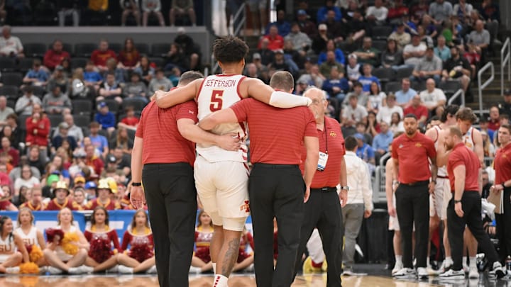 Mar 20, 2026; St. Louis, MO, USA; Iowa State Cyclones forward Joshua Jefferson (5) is helped off of the court after suffering an apparent injury to his left leg against Tennessee State Tigers during the first half of a first round game of the men's 2026 NCAA Tournament at Enterprise Center. Mandatory Credit: Jeff Curry-Imagn Images