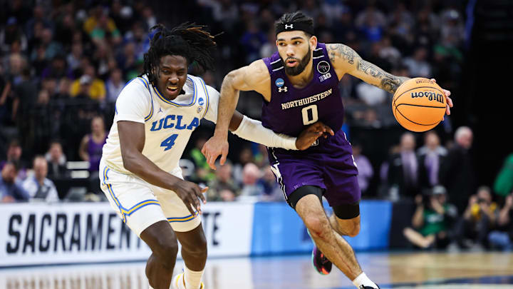 Mar 18, 2023; Sacramento, CA, USA; Northwestern Wildcats guard Boo Buie (0) drives to the basket while defended by UCLA Bruins guard Will McClendon (4) during the second half at Golden 1 Center. Mandatory Credit: Kelley L Cox-Imagn Images