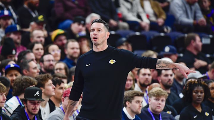 Dec 1, 2024; Salt Lake City, Utah, USA; Los Angeles Lakers head coach JJ Redick calls a play on the court against the Utah Jazz during the first half at the Delta Center. Mandatory Credit: Christopher Creveling-Imagn Images