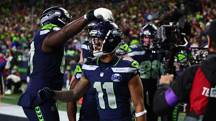 Jan 17, 2026; Seattle, WA, USA; Seattle Seahawks wide receiver Jaxon Smith-Njigba (11) reacts with teammates after catching a touchdown pass against the San Francisco 49ers during the first half in an NFC Divisional Round game at Lumen Field. Mandatory Credit: Kevin Ng-Imagn Images Jan 17, 2026; Seattle, WA, USA; Seattle Seahawks wide receiver Jaxon Smith-Njigba (11) reacts with teammates after catching a touchdown pass against the San Francisco 49ers during the first half in an NFC Divisional Round game at Lumen Field. Mandatory Credit: Kevin Ng-Imagn Images