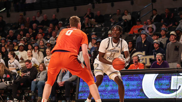 Jan 14, 2025; Atlanta, Georgia, USA; Georgia Tech Yellow Jackets forward Baye Ndongo (11) looks for the shot against Clemson Tigers center Viktor Lakhin (0) during the first half at McCamish Pavilion. Mandatory Credit: Jordan Godfree-Imagn Images