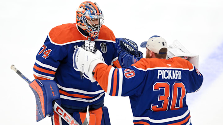 Edmonton Oilers goaltender Stuart Skinner reacts with goaltender Calvin Pickard after defeating the Florida Panthers.