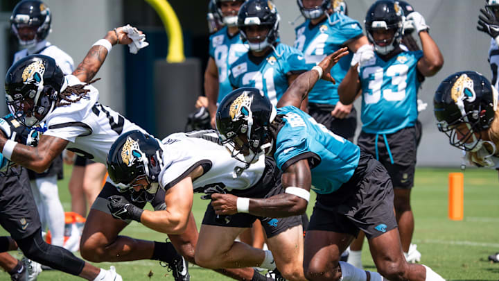 Jacksonville Jaguars running back Tank Bigsby (4), right, sprints during the fourth organized team activity at the Miller Electric Center in Jacksonville, Fla. Tuesday, May 27, 2025. [Doug Engle/Florida Times-Union]