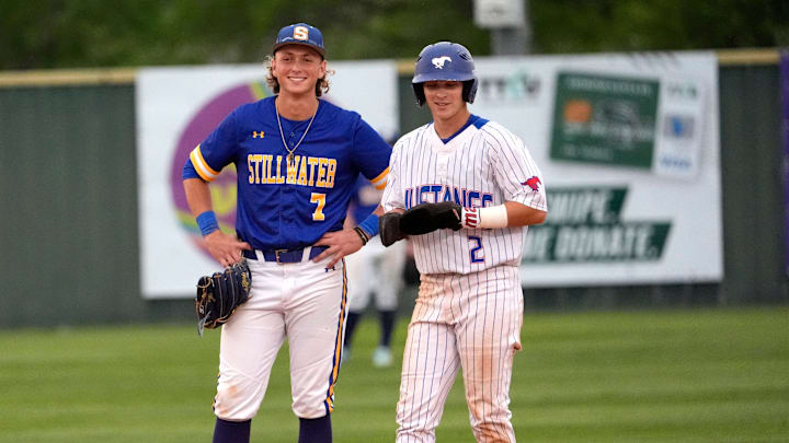 Fort Cobb-Broxton's Eli Willits talks with Stillwater's Ethan Holliday during the high school baseball game between Fort Cobb-Broxton and Stillwater at Edmond Santa Fe High School in Edmond, Okla., on April 18, 2025.