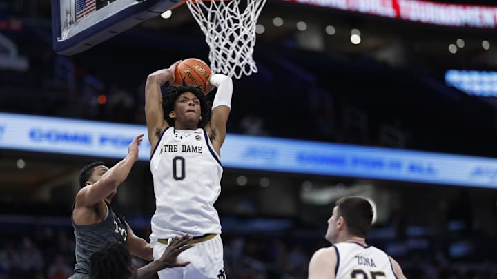 Mar 12, 2024; Washington, D.C., USA; Notre Dame Fighting Irish forward Carey Booth (0) dunks the