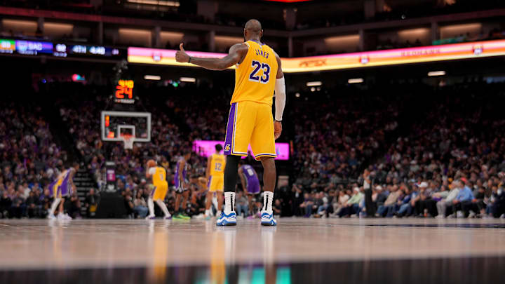 Dec 19, 2024; Sacramento, California, USA; Los Angeles Lakers forward LeBron James (23) gives a thumbs up towards the team bench during a free throw attempt against the Sacramento Kings in the fourth quarter at the Golden 1 Center. Mandatory Credit: Cary Edmondson-Imagn Images