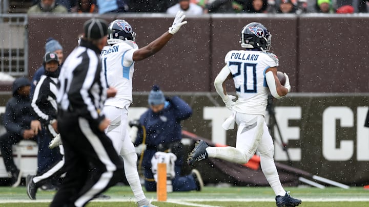 Dec 7, 2025; Cleveland, Ohio, USA; Tennessee Titans running back Tony Pollard (20) runs for a sixty-five yard touchdown against the Cleveland Browns during the second quarter at Huntington Bank Field. Mandatory Credit: Scott Galvin-Imagn Images