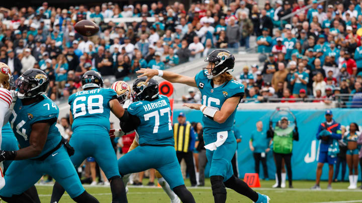 Nov 12, 2023; Jacksonville, Florida, USA; Jacksonville Jaguars quarterback Trevor Lawrence (16) throws a pass with offensive lineman Brandon Scherff (68), offensive tackle Anton Harrison (77), and offensive lineman Cam Robinson (74) block San Francisco 49ers defense during the third quarter at EverBank Stadium. Mandatory Credit: Morgan Tencza-USA TODAY Sports