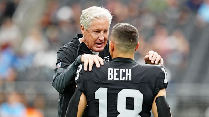 Oct 12, 2025; Paradise, Nevada, USA; Las Vegas Raiders wide receiver Jack Bech (18) and Las Vegas Raiders head coach Pete Carroll talk before the game against the Tennessee Titans at Allegiant Stadium. Mandatory Credit: Stephen R. Sylvanie-Imagn Images