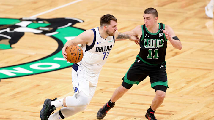 Jun 9, 2024; Boston, Massachusetts, USA; Dallas Mavericks guard Luka Dončić (77) dribbles the ball against Boston Celtics guard Payton Pritchard (11) during the fourth quarter in game two of the 2024 NBA Finals at TD Garden.