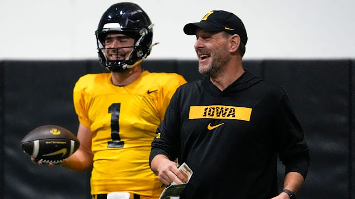 Iowa quarterback Brendan Sullivan (1) and offensive coordinator Tim Lester are pictured during practice Thursday, April 3, 2025 in Iowa City, Iowa.
