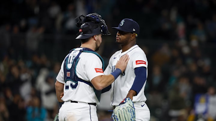 Apr 12, 2025; Seattle, Washington, USA; Seattle Mariners pitcher Gregory Santos (48) celebrates with catcher Cal Raleigh (29) following a victory against the Texas Rangers at T-Mobile Park. Mandatory Credit: Joe Nicholson-Imagn Images