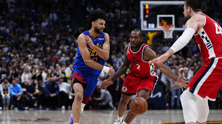Denver Nuggets guard Jamal Murray (27) passes the ball toward LA Clippers forward Kawhi Leonard (2) in overtime at Ball Arena. Mandatory Credit: Ron Chenoy-Imagn Images