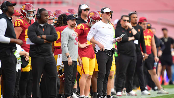 Nov 30, 2024; Los Angeles, California, USA; Southern California Trojans head coach Lincoln Riley watches game action against the Notre Dame Fighting Irish during the first half at the Los Angeles Memorial Coliseum. Mandatory Credit: Gary A. Vasquez-Imagn Images