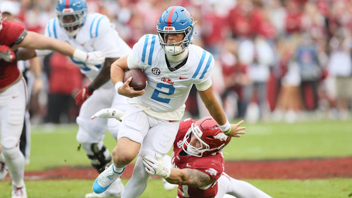 Nov 2, 2024; Fayetteville, Arkansas, USA; Ole Miss Rebels quarterback Jaxson Dart (2) rushes in the first quarter against the Arkansas Razorbacks at Donald W. Reynolds Razorback Stadium. Mandatory Credit: Nelson Chenault-Imagn Images Nov 2, 2024; Fayetteville, Arkansas, USA; Ole Miss Rebels quarterback Jaxson Dart (2) rushes in the first quarter against the Arkansas Razorbacks at Donald W. Reynolds Razorback Stadium. Mandatory Credit: Nelson Chenault-Imagn Images