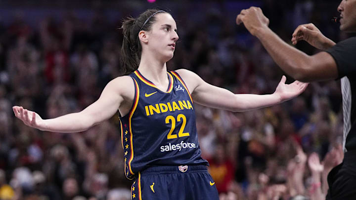 Sep 15, 2024; Indianapolis, Indiana, USA; Indiana Fever guard Caitlin Clark (22) celebrates a three-point basket at Gainbridge Fieldhouse. Mandatory Credit: Grace Hollars/USA TODAY Network via Imagn Images