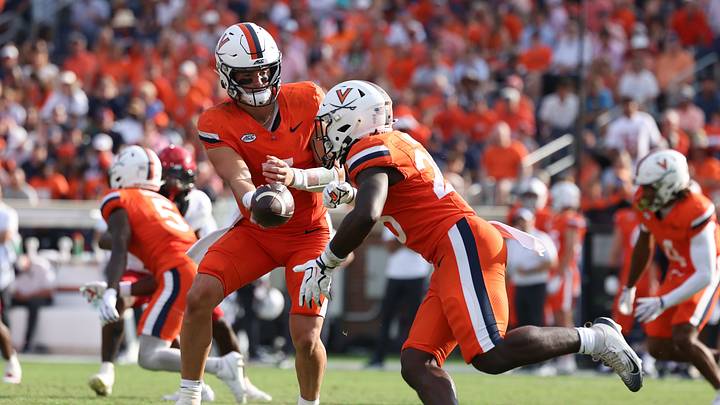 Aug 29, 2026; Charlottesville, Virginia, USA; Virginia Cavaliers quarterback Beau Pribula (7) hands off to running back Xay Davis (25) during the third quarter of the game against the North Carolina State Wolfpack at Scott Stadium. Mandatory Credit: Greg Atkins-Imagn Images Aug 29, 2026; Charlottesville, Virginia, USA; Virginia Cavaliers quarterback Beau Pribula (7) hands off to running back Xay Davis (25) during the third quarter of the game against the North Carolina State Wolfpack at Scott Stadium. Mandatory Credit: Greg Atkins-Imagn Images