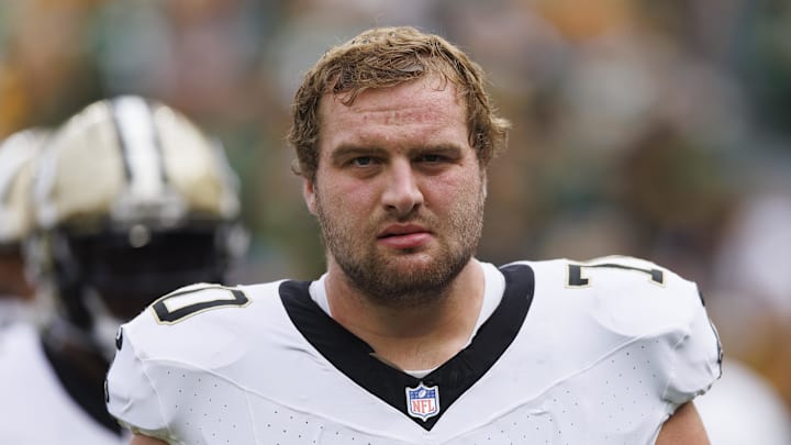 Sep 24, 2023; Green Bay, Wisconsin, USA;  New Orleans Saints offensive tackle Trevor Penning (70) during warmups prior to the game against the Green Bay Packers at Lambeau Field. Mandatory Credit: Jeff Hanisch-Imagn Images