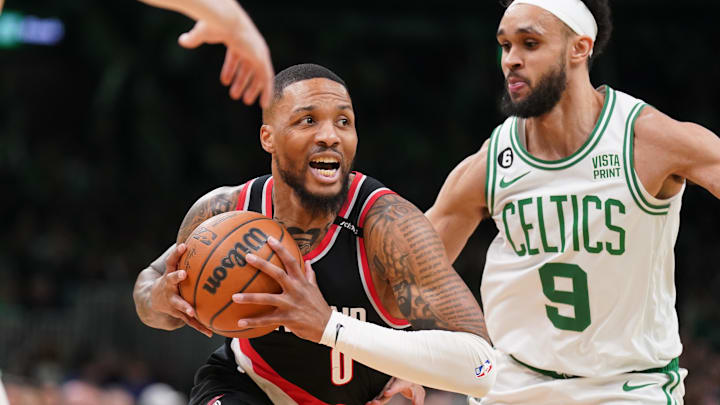Mar 8, 2023; Boston, Massachusetts, USA; Portland Trail Blazers Damian Lillard (0) drives the ball against Boston Celtics guard Derrick White (9) in the first quarter at TD Garden. Mandatory Credit: David Butler II-Imagn Images Mar 8, 2023; Boston, Massachusetts, USA; Portland Trail Blazers Damian Lillard (0) drives the ball against Boston Celtics guard Derrick White (9) in the first quarter at TD Garden. Mandatory Credit: David Butler II-Imagn Images